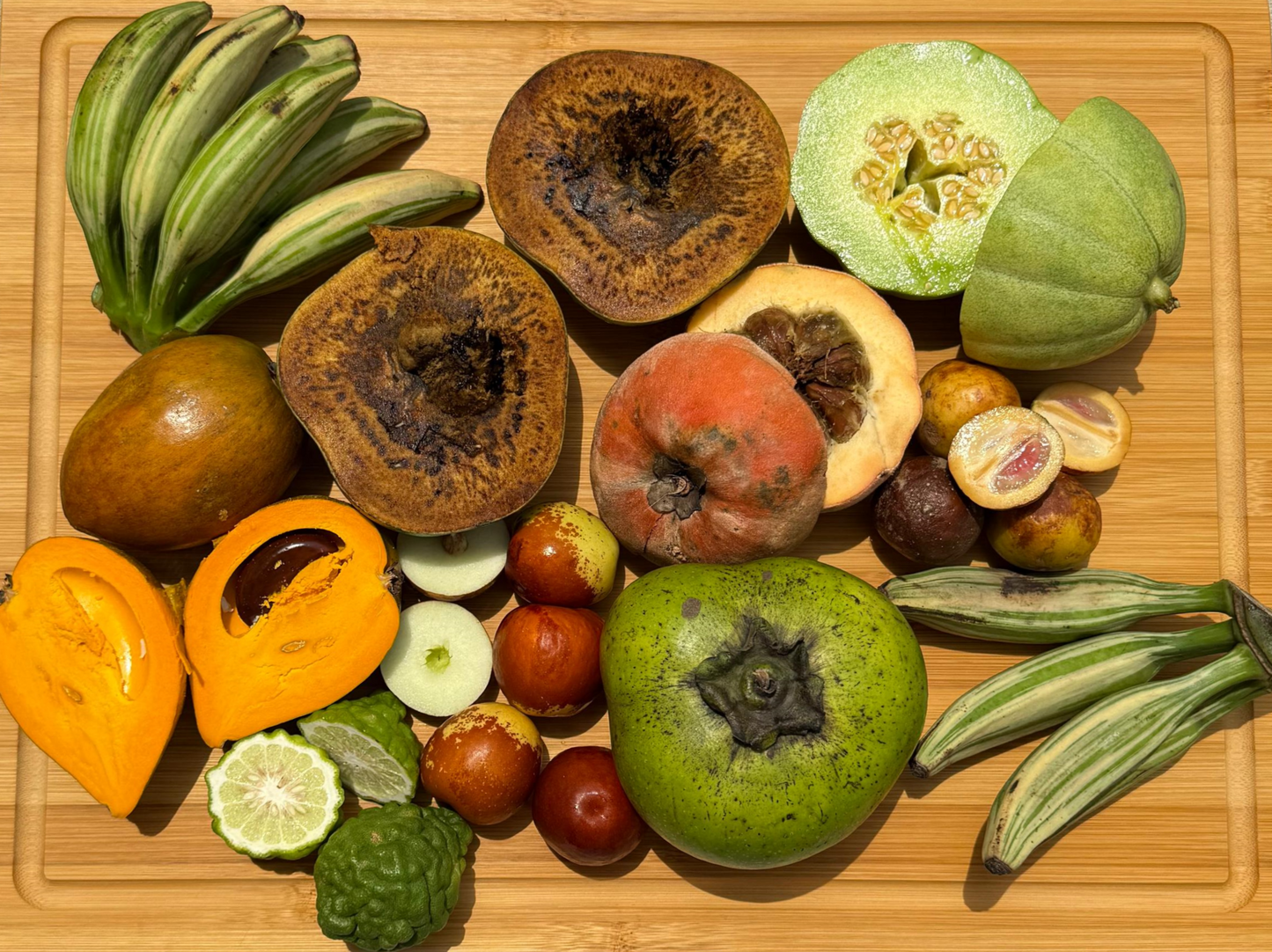 Assorted fruits and vegetables on a wooden cutting board