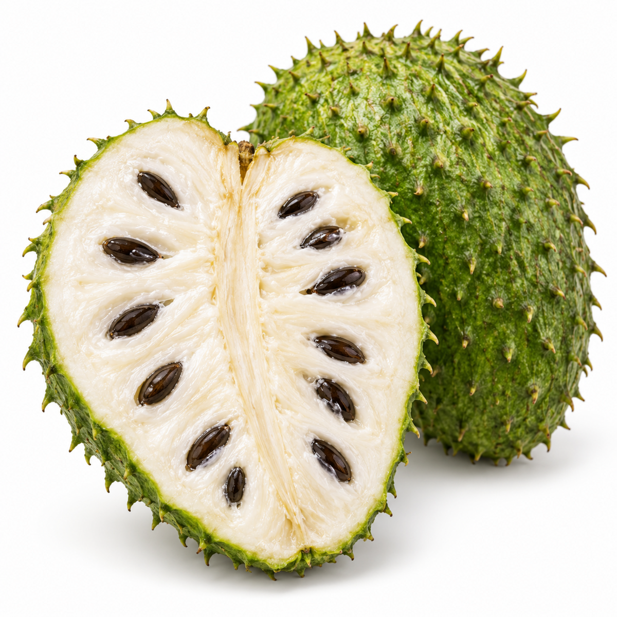 Soursop cut open showing white flesh and black seeds