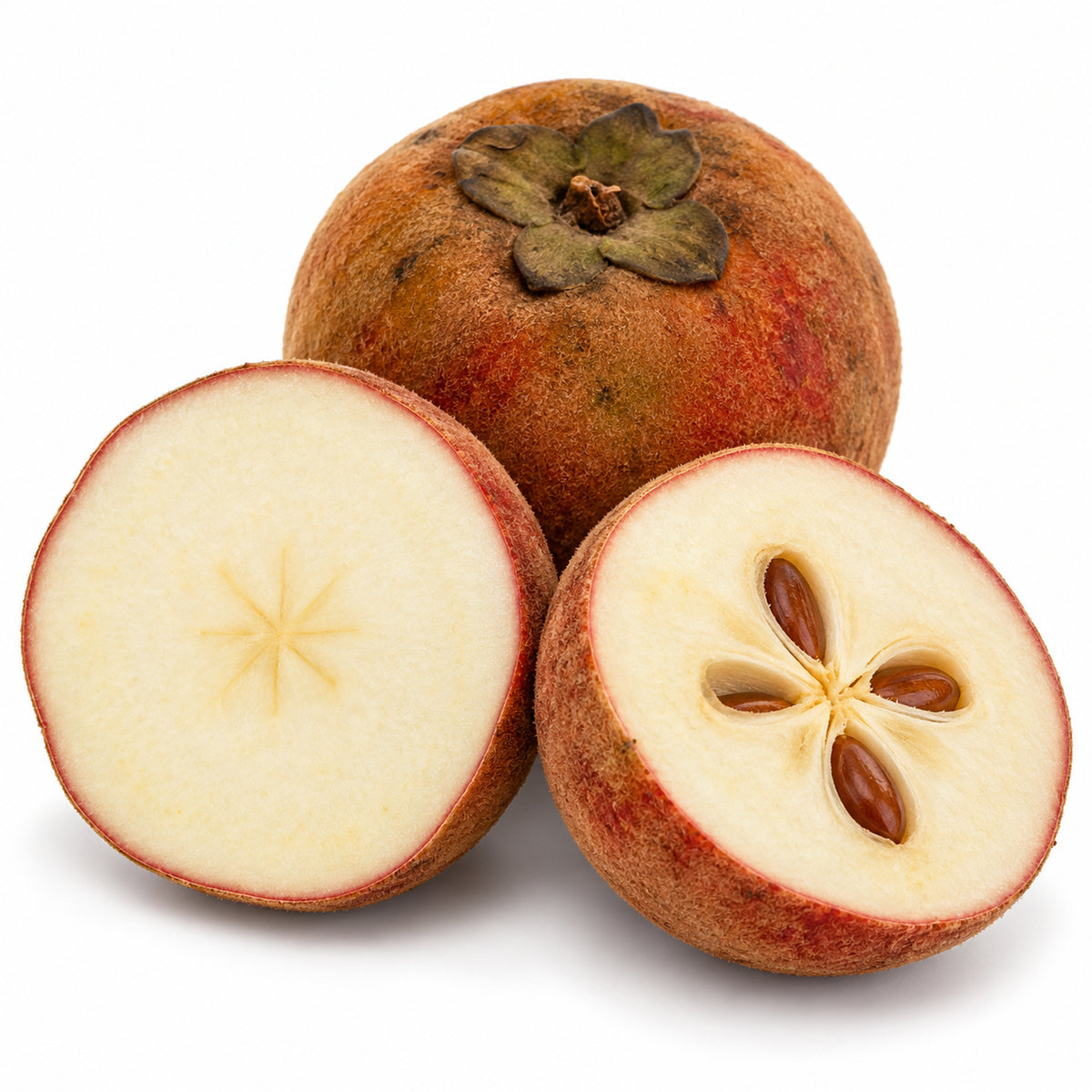 Velvet apple cut open to show pale flesh and brown seeds, with a whole fruit on a white background